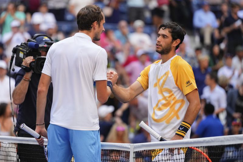 Daniil Medvedev, of Russia, greets Nuno Borges, of Portugal, at the net after winning a match in the fourth round of the U.S. Open tennis championships, Monday, Sept. 2, 2024, in New York. (AP Photo/Kirsty Wigglesworth)