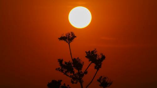 The sun rises amid high temperatures in Mexico City, Thursday, May 23, 2024. Extreme heat in Mexico, Central America and parts of the U.S. South has left millions of people in sweltering temperatures, strained energy grids and resulted in iconic Howler monkeys in Mexico dropping dead from trees. (AP Photo/Marco Ugarte)