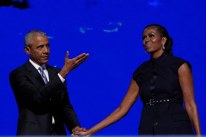 Former President Barack Obama hugs former first lady Michelle Obama as he is introduced during the Democratic National Convention Tuesday, Aug. 20, 2024, in Chicago. (AP Photo/Brynn Anderson)