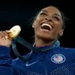 FILE - Simone Biles, of the United States, celebrates winning the gold medal during the medal ceremony in the women's artistic gymnastics individual vault finals at Bercy Arena at the 2024 Summer Olympics, Aug. 3, 2024, in Paris, France. (AP Photo/Francisco Seco, File)