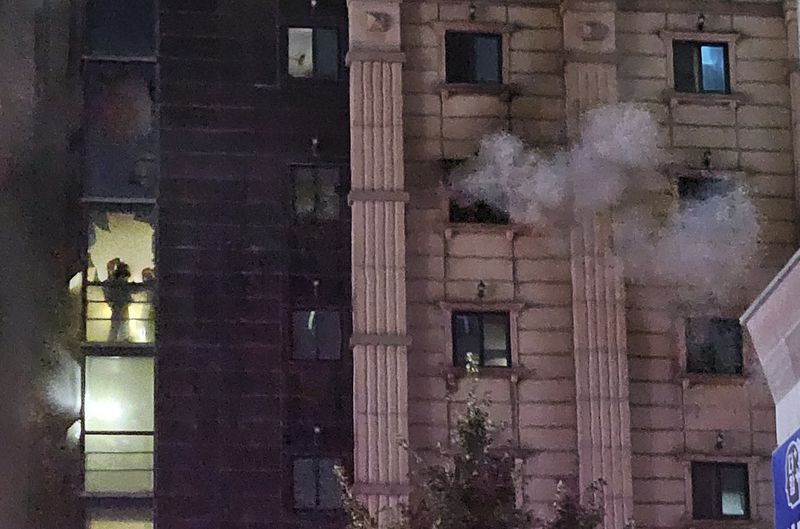 Firefighters work to extinguish a fire at a hotel in Bucheon, South Korea, Thursday, Aug. 22, 2024. (Lee Lu-bee/Newsis via AP)