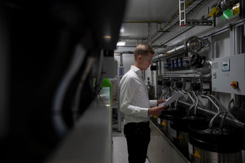 Jordi Zonneveld works at Plug Power where they produce green hydrogen in Alphen aan den Rijn, Netherlands, Friday, June 16, 2023. (AP Photo/Peter Dejong)