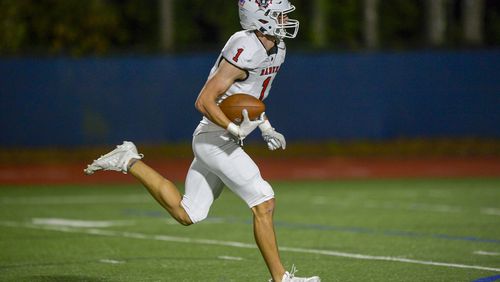 Rabun County wide receiver Adriel Clark (1) heads toward the end zone for a touchdown during Friday's game against Pope.