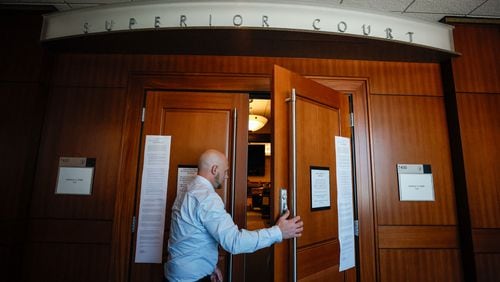 David Andrews, a defendant in a criminal case, entered the courtroom on the 7th floor of the Cobb County Superior Court after Chief Judge Gregory Poole issued a 30-day emergency order on Wednesday. The order suspends filing deadlines and other administrative requirements in civil and criminal cases. (Miguel Martinez / AJC)