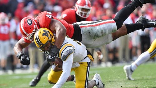 Missouri's quarterback Tyler Macon (10) is sacked by Georgia's defensive lineman Travon Walker (44) in the second half during a NCAA football game at Sanford Stadium in Athens on Saturday, November 6, 2021. Georgia won 43-6 over Missouri. (Hyosub Shin / Hyosub.Shin@ajc.com)