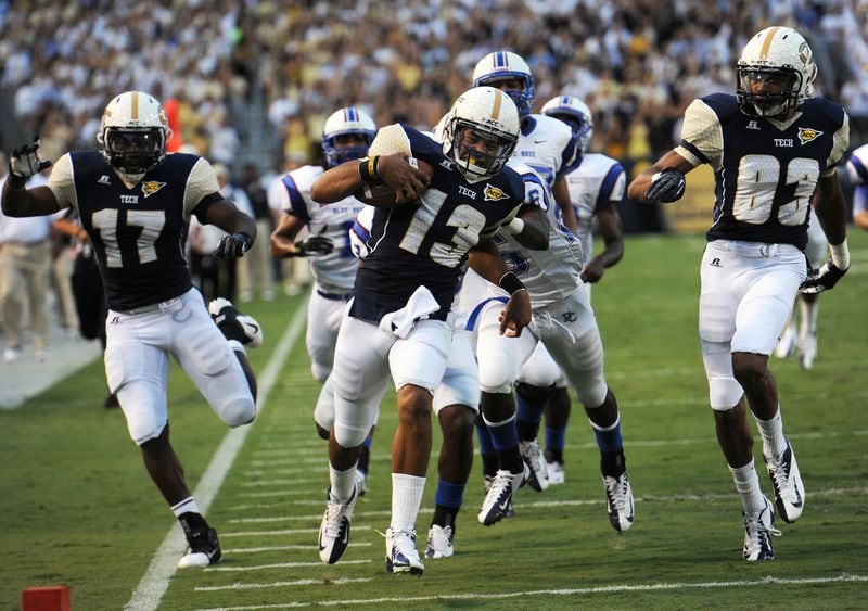 Georgia Tech's Tevin Washington runs for a touchdown against the Presbyterian's defense in the first quarter in Bobby Dodd Stadium on Sept. 8, 2012. He scored a touchdown on the play. JOHNNY CRAWFORD /JCRAWFORD@AJC.COM