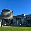 FILE - People arrive at Parliament in Wellington, New Zealand, Wednesday, July 24, 2024. (AP Photo/Charlotte Graham-McLay, File)