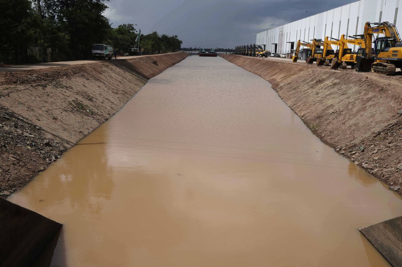 A view from a water gate to the Funan Techo Canal connecting from Mekong River at Prek Takeo village, eastern Phnom Penh Cambodia, Tuesday, July 30, 2024. (AP Photo/Heng Sinith)