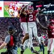 Alabama defensive back Domani Jackson, left, celebrates with defensive back Zabien Brown (2) and linebacker Que Robinson (34) after Brown intercepted a pass in the final minute during the second half of an NCAA college football game against Georgia, Saturday, Sept. 28, 2024, in Tuscaloosa, Ala. (AP Photo/Vasha Hunt)