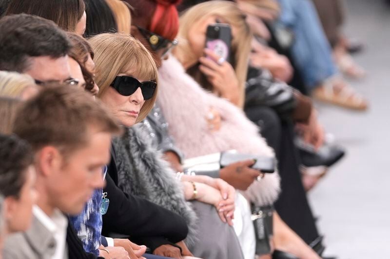 Anna Wintour watches models walk the runway during the Michael Kors Collection spring/summer 2025 fashion show as part of New York Fashion Week, Tuesday, Sept. 10, 2024, in New York. (AP Photo/Pamela Smith)