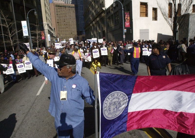 During a January 2001 the march for the MLK Day holiday, then State Rep. Tyrone Brooks carried the pre-1956 Georgia state flag along the march route. By 2001, the idea of making some kind of change to the 1956 flag design was starting to gain momentum, although many Georgians wished to see the flag remain unaltered. New Governor Roy Barnes supported the push for a new flag and hurried legislation through the state house, settling on a compromise design that incorporated all of Georgia's previous flags into the new design.