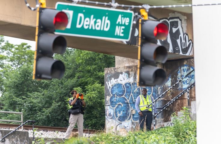 MARTA police and the Fulton County Medical Examiner’s office were on the scene of Rocky Ford Road and the MARTA train tracks investigating a death that shut down a section of track in Atlanta’s Kirkwood neighborhood after a suspected trespasser was hit and killed Thursday morning, June 6, 2024 by a westbound train. (John Spink/AJC)