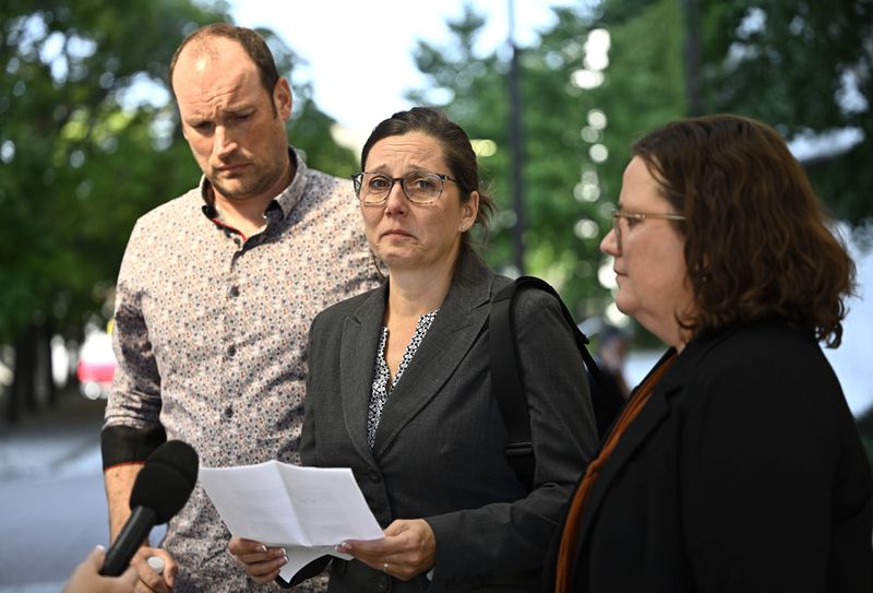 Stephanie Viau makes a statement to journalists outside the courthouse after former Vice Adm. Haydn Edmundson was found not guilty of sexual assault and an indecent act, Monday, Sept. 16, 2024, in Ottawa. (Justin Tang/The Canadian Press via AP)