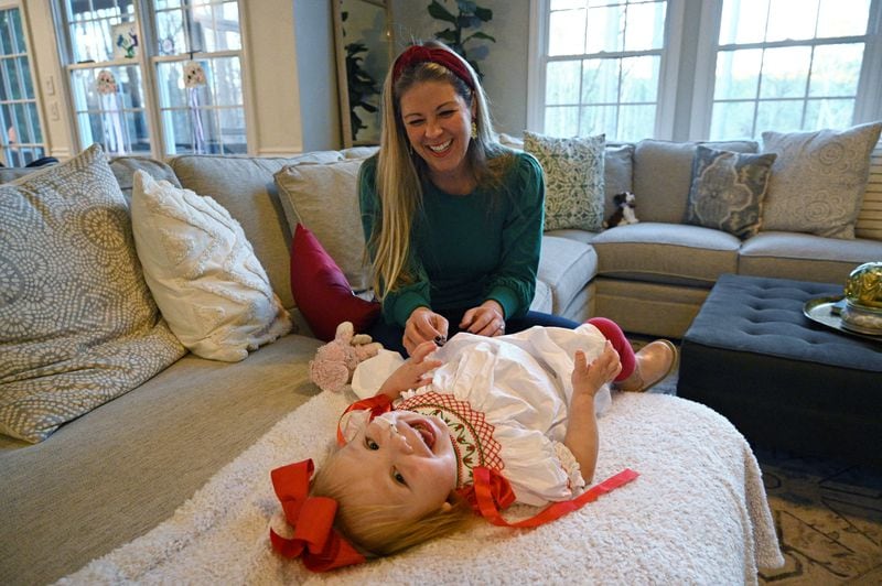 Emmie still has many challenges ahead: She maintains a feeding tube for now, gets lab work done each week and continues regular visits with specialists. And the family must take procautions to keep her immunocompromised body protected from viruses. (Hyosub Shin / Hyosub.Shin@ajc.com)