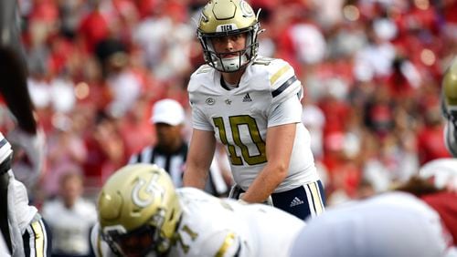 Georgia Tech quarterback Haynes King (10) looks out over the Louisville defensive line before the snap during the first half of an NCAA college football game in Louisville, Ky., Saturday, Sept. 21, 2024. Louisville won 31-19. (AP Photo/Timothy D. Easley)