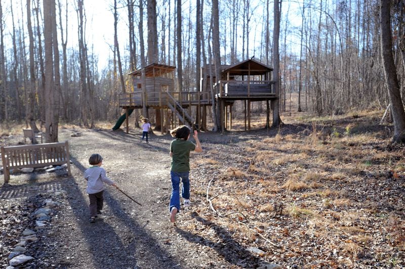 PALMETTO, GA - FEBRUARY 12: The Lollis family children play at the kid-designed treehouse at the Serenbe community in Palmetto, Georgia on Thursday, February 12, 2009. The idyllic community - which aspires to be something of a Napa for the New South, is about 25 miles south of the Atlanta airport. PHOTO CREDIT: ERIK S. LESSER FOR THE NEW YORK TIMES