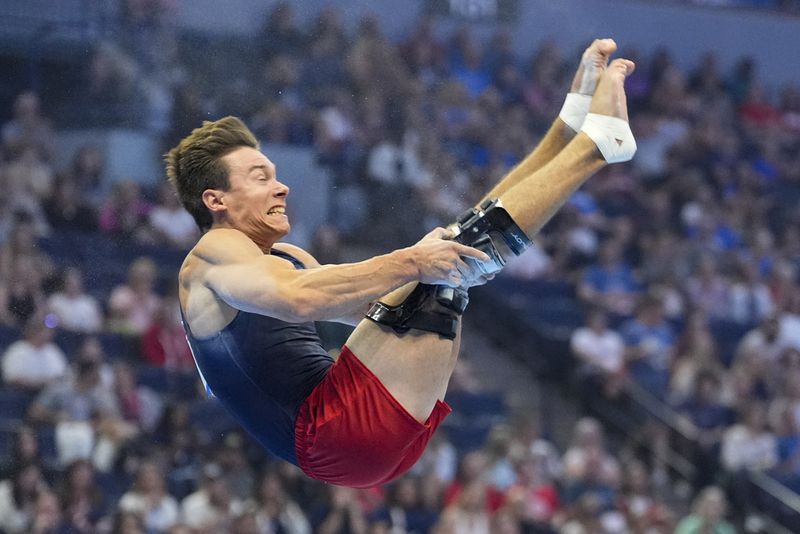 Brody Malone competes in the floor exercise at the United States Gymnastics Olympic Trials on Thursday, June 27, 2024, in Minneapolis. (AP Photo/Charlie Riedel)