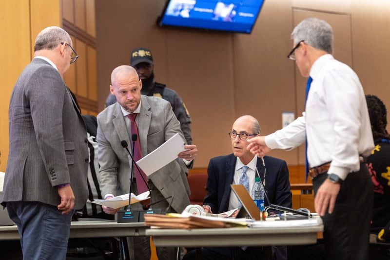 Defense attorneys review documents during the ongoing “Young Slime Life” gang trial in Atlanta on Monday, October 23, 2023. (Arvin Temkar / arvin.temkar@ajc.com)