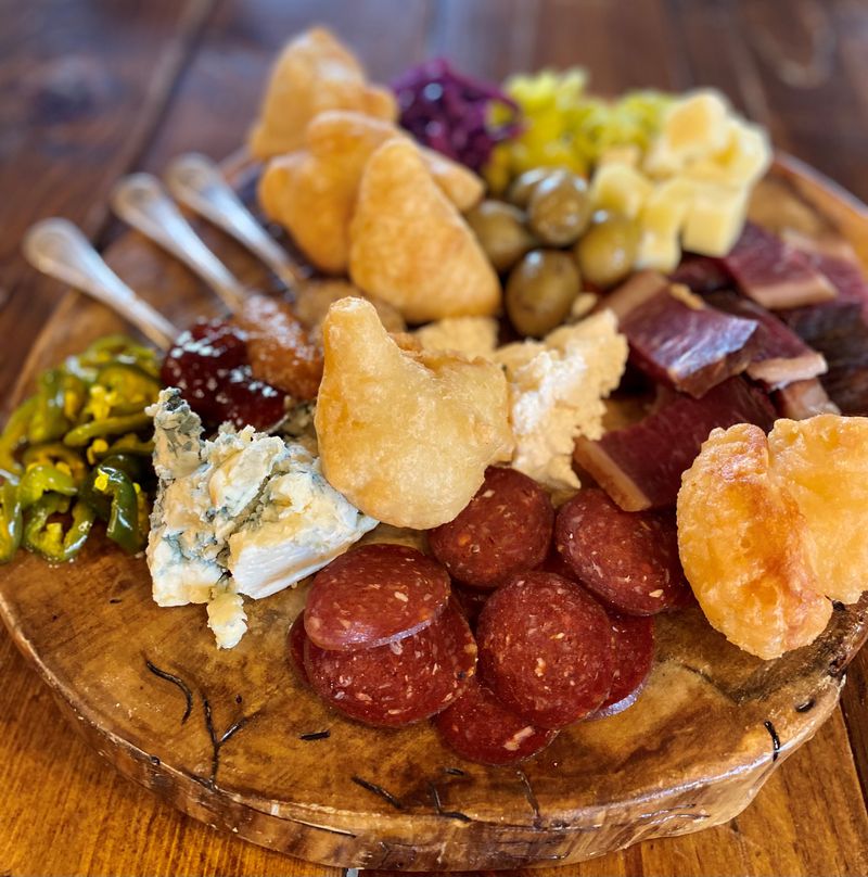 Best End Brewing chef Adi Komic hails from Bosnia, and his Balkan homeland influences his charcuterie board. (Wendell Brock for The Atlanta Journal-Constitution)