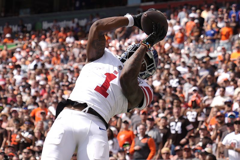 New York Giants wide receiver Malik Nabers (1) catches a touchdown pass against the Cleveland Browns during the first half of an NFL football game, Sunday, Sept. 22, 2024 in Cleveland. (AP Photo/Sue Ogrocki)