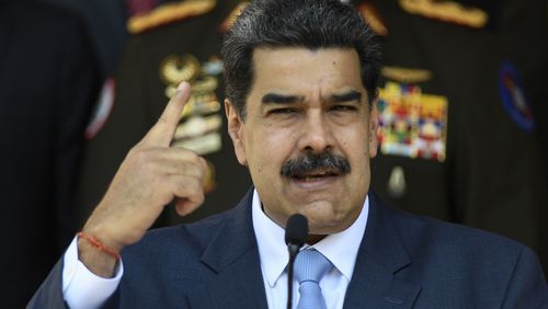 FILE - In this March 12, 2020 file photo, Venezuelan President Nicolas Maduro gives a press conference at the Miraflores presidential palace in Caracas, Venezuela. Jordan Goudreau, a former U.S. Green Beret who organized a failed crossborder raid in 2020 to remove President Maduro has been arrested in New York. (AP Photo/Matias Delacroix, File)