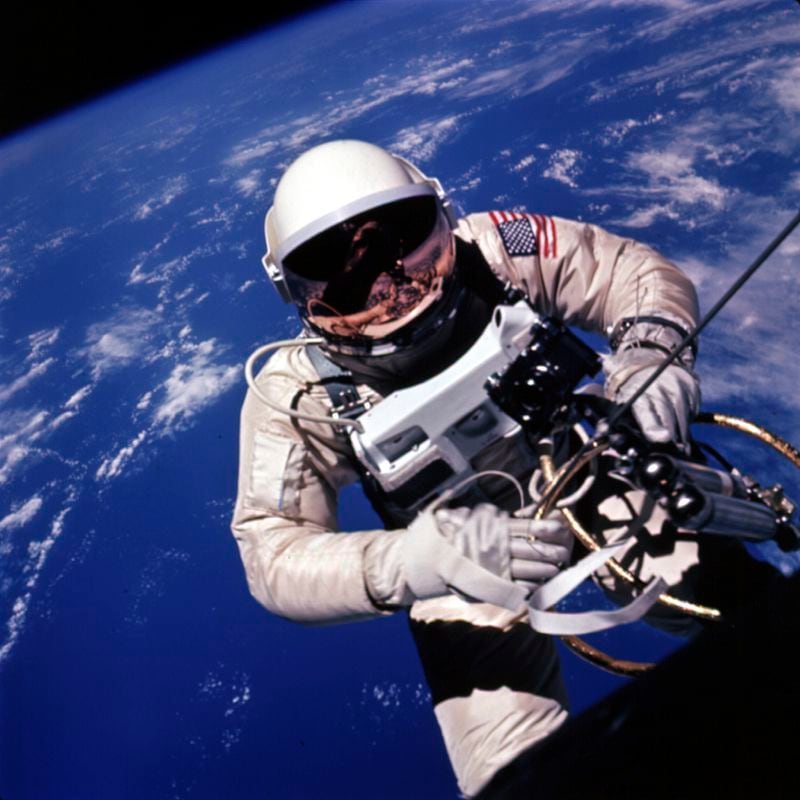 In this photo provided by NASA, astronaut Ed White backs away from the Gemini spacecraft to start the U.S.'s first spacewalk on June 3, 1965, during the Gemini 4 mission. (James McDivitt/NASA via AP)