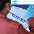 A Fulton County election worker scans absentee ballots in 2020. For the 2024 election, voters can track their ballots through the state's My Voter Page. (John Spink/AJC 2020)