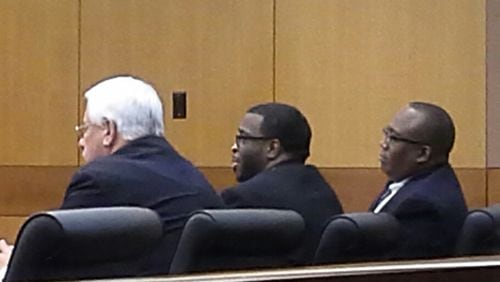 Jeremy Moody (center) is flanked by his attorneys (right to left) Bill Morrison and Maurice Kenner. Moody pleaded guilty on Wednesday to brutally murdering two College Park teens in April 2007 and to raping one of the teens during a robbery attempt.