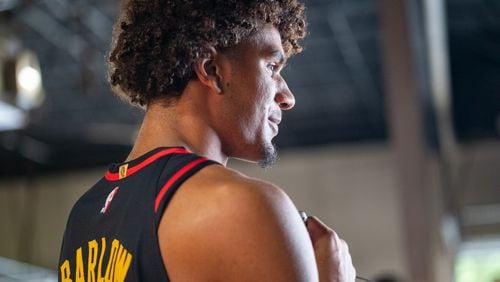 Hawks player Dominick Barlow, #0, takes interview questions during media day. Hawks media day takes place on Monday, Sept 30, 2024 where media outlets including the Associated Press, Getty, NBA and many others gather to take photos, conduct interviews and gather footage.   (Jenni Girtman for The Atlanta Journal-Constitution)