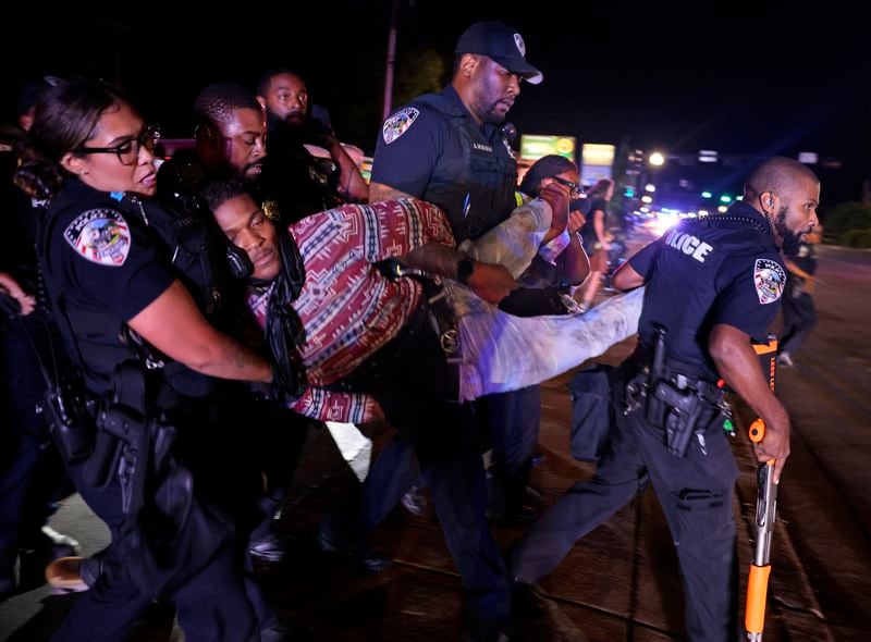 FILE - Ferguson police arrest Elijah Gantt outside the police department during a protest on the 10th anniversary of Michael Brown's death, Aug. 9, 2024, in Ferguson, Mo. (Christian Gooden//St. Louis Post-Dispatch via AP, File)