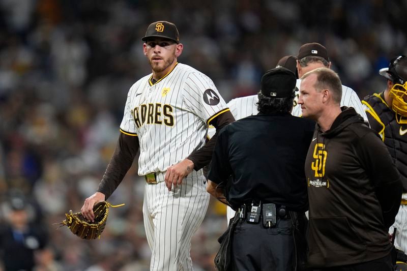 San Diego Padres starting pitcher Joe Musgrove exits the game during the fourth inning in Game 2 of an NL Wild Card Series baseball game against the Atlanta Braves, Wednesday, Oct. 2, 2024, in San Diego. (AP Photo/Gregory Bull)