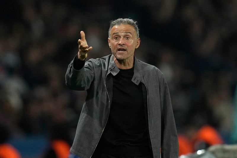 PSG's head coach Luis Enrique gives instructions during the Champions League opening phase soccer match between Paris Saint-Germain and Girona at the Parc des Princes stadium in Paris, France, Wednesday, Sept. 18, 2024. (AP Photo/Christophe Ena)