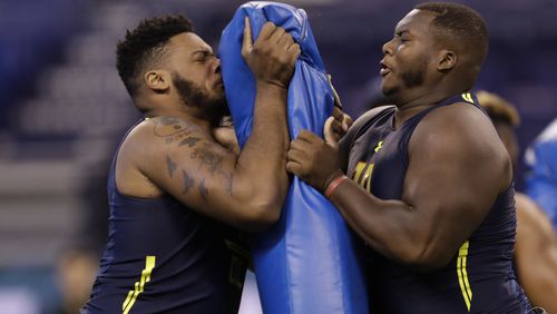 Bucknell offensive lineman Julien Davenport runs a drill at the NFL football scouting combine Friday, March 3, 2017, in Indianapolis. (AP Photo/David J. Phillip)