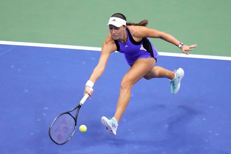 Jessica Pegula, of the United States, reaches for a shot by Aryna Sabalenka, of Belarus, during the women's singles final of the U.S. Open tennis championships, Saturday, Sept. 7, 2024, in New York. (AP Photo/Kirsty Wigglesworth)