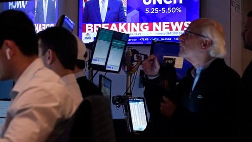 A television screen on the floor of the New York Stock Exchange, shows the Federal Reserve rate decision, Wednesday, July 31, 2024.(AP Photo/Richard Drew)