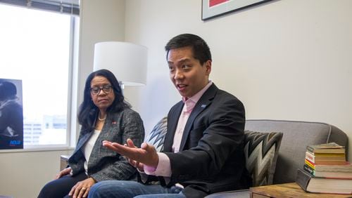 Sean Young, the legal director of the American Civil Liberties Union of Georgia, and the group’s executive director, Andrea Young, speak at the Selig Building in Atlanta in April 2018. (REANN HUBER/REANN.HUBER@AJC.COM)