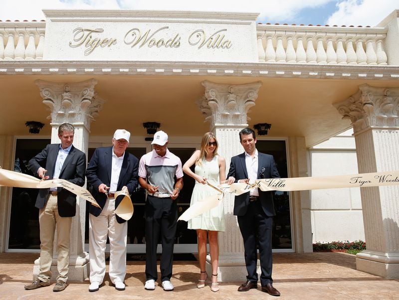 Eric Trump (from left), Donald Trump, Tiger Woods, Ivanka Trump and Donald Trump Jr. cut a ribbon in front of the Tiger Woods Villa prior to the start of the World Golf Championships-Cadillac Championship at Trump National Doral on March 5, 2014.  (Photo by Scott Halleran/Getty Images)