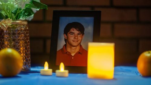 A photo of Chet Planchard, who was one of four people killed by Ronald Freeman 30 years ago during a robbery and shooting spree, is displayed during a vigil Thursday night in Marietta. (Branden Camp for The Atlanta Journal-Constitution)