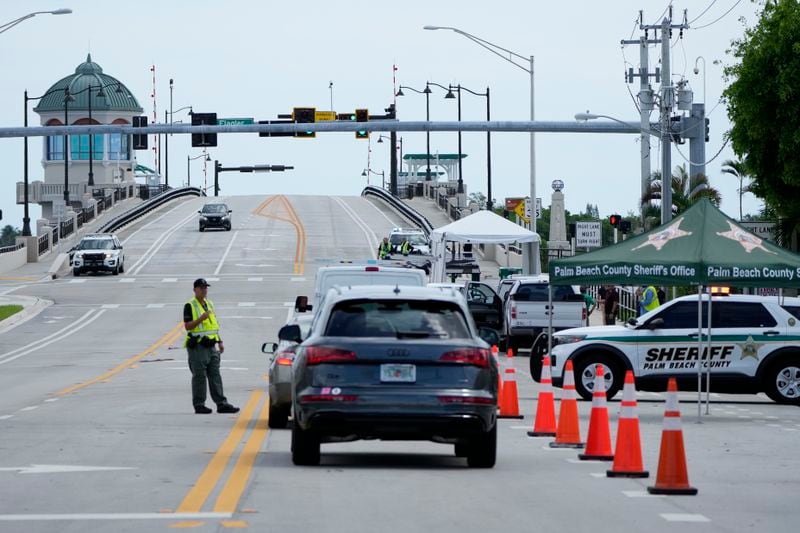 A Palm Beach County Sheriff's officer works at a checkpoint near the bridge that leads to the Mar-a-Lago estate after the apparent assassination attempt of Republican presidential nominee and former President Donald Trump Monday, Sept. 16, 2024, in West Palm Beach, Fla. (AP Photo/Lynne Sladky)