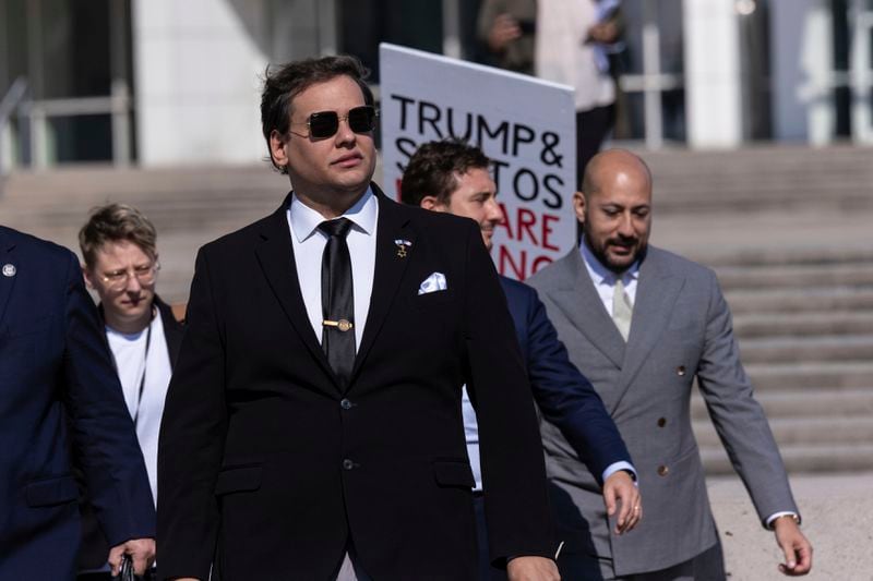 Former U.S. Rep George Santos leaves the federal courthouse with his lawyers in Central Islip, N.Y. on, Monday, Aug., 19, 2024 in New York. (AP Photo/Stefan Jeremiah)