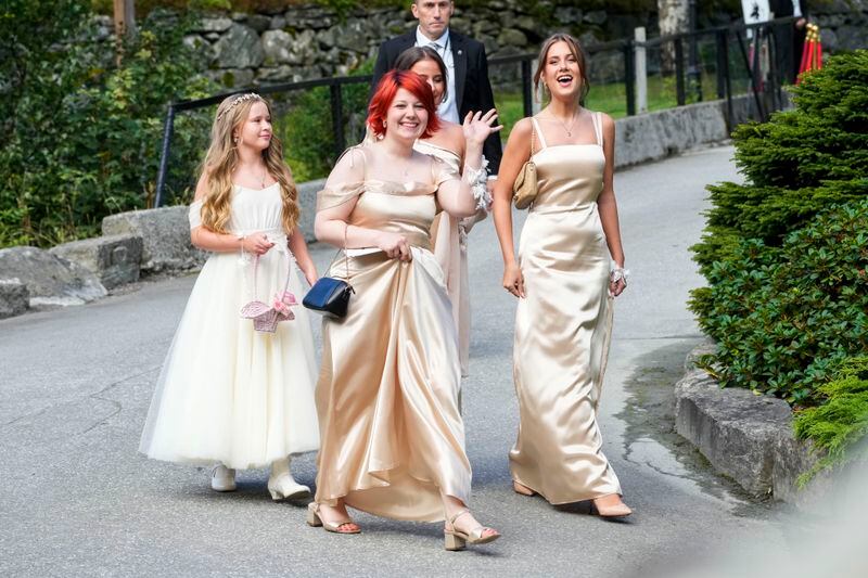 The daughters of Norway's Princess Martha Louise, Maud Angelica Behn, Emma Tallulah Behn and Leah Isadora Behn, in Geiranger, Norway, Saturday Aug. 31, 2024, during the wedding of Princess Martha Louise and Durek Verrett. (Cornelius Poppe/NTB via AP)