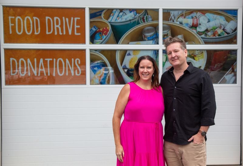 Crystal Genter and Stephen Cook, of the architectural firm Goode Van Slyke, at the Atlanta Community Food Bank in East Point. The firm is celebrating its 25th anniversary by doing 25 good deeds. PHIL SKINNER FOR THE ATLANTA JOURNAL-CONSTITUTION.