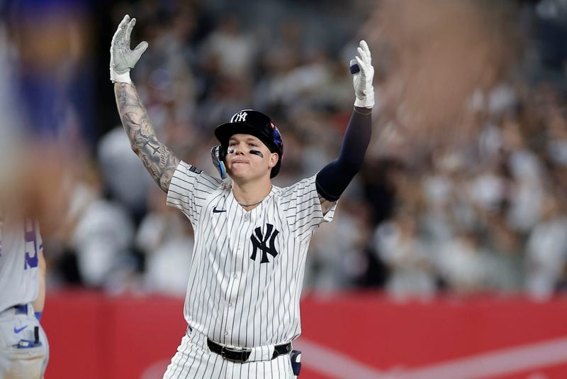 New York Yankees' Alex Verdugo reacts after driving in a run on a double against the Kansas City Royals during the seventh inning of Game 1 of the American League baseball division series, Saturday, Oct. 5, 2024, in New York. (AP Photo/Adam Hunger)