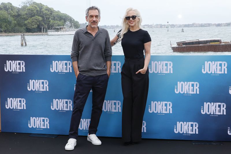 Director Todd Phillips, left, and Lady Gaga pose for photographers at the photo call for the film 'Joker: Folie A Deux' at the hotel Cipriani during the 81st edition of the Venice Film Festival in Venice, Italy, on Thursday, Sept. 5, 2024. (Photo by Joel C Ryan/Invision/AP)