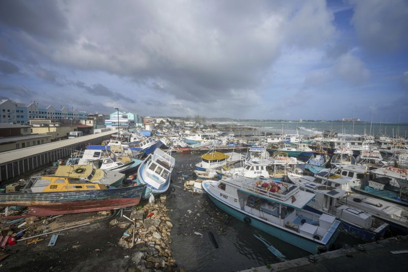Fishing vessels lie damaged after Hurricane Beryl passed through the Bridgetown Fisheries in Barbados, Monday, July 1, 2024. (AP Photo/Ricardo Mazalan)