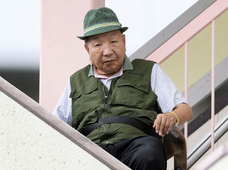 Iwao Hakamada, 88-year-old former boxer who has been on death row for nearly six decades after his murder conviction that his lawyers said was based on forced confession and fabricated evidence, goes for a walk in Hamamatsu, Shizuoka prefecture, central Japan Thrusday, Sept. 26, 2024. (Kyodo News via AP)