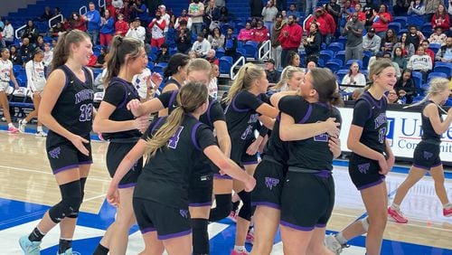 North Forsyth players celebrate their 43-33 victory over Veterans in the Class 6A girls basketball semifinals at the University of West Georgia Coliseum on March 2, 2024.