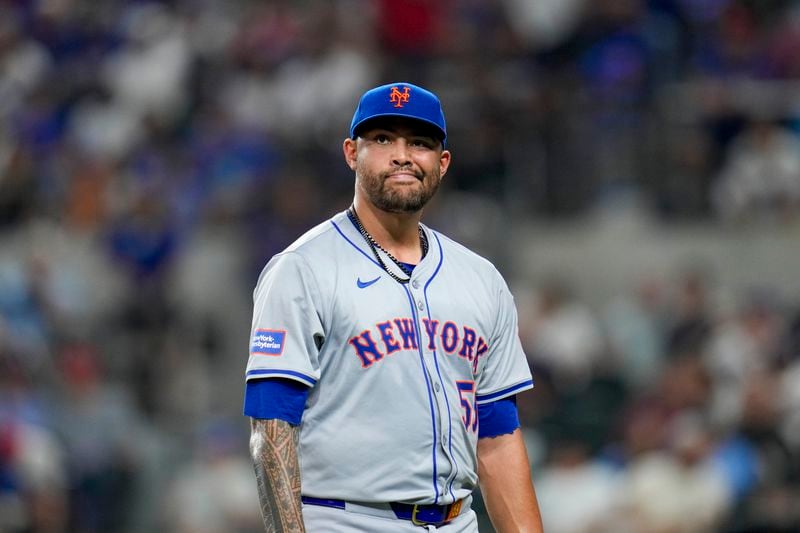 New York Mets pitcher Sean Manaea heads to the dugout after being pulled for a reliever against the Texas Rangers during the sixth inning of a baseball game, Wednesday, June 19, 2024, in Arlington, Texas. (AP Photo/Julio Cortez)