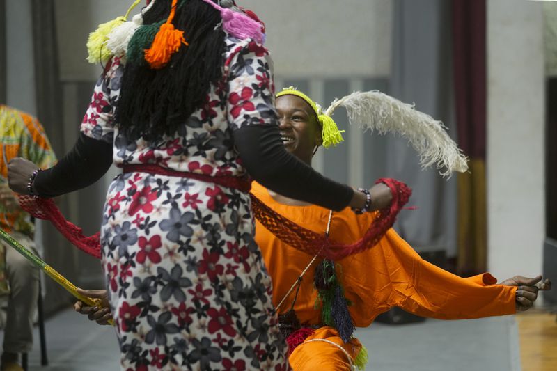 Sudanese Camirata troupe dancers perform a dance from South Sudan, during a show at the Russian culture center in Cairo, Egypt, Sunday, Sept. 15, 2024. (AP Photo/Amr Nabil)