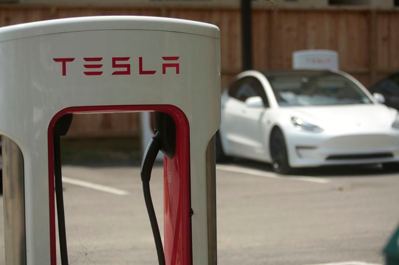 A Tesla supercharging location is seen on Kipling Street, June 3, 2024 in Houston. (AP Photo/Lekan Oyekanmi)
